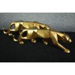 A pair of geometric Art Deco style leopard figures. Resin painted in gold. H.15 W.49cm. (each)