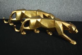 A pair of geometric Art Deco style leopard figures. Resin painted in gold. H.15 W.49cm. (each)