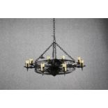 A gothic style candle chandelier. In a black finish with and candle holders. Dia.70cm.
