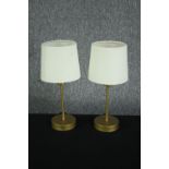 A pair of modern table lamps. Light metal finished in gold. H.34cm. (each)