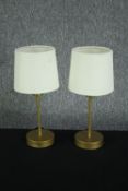 A pair of modern table lamps. Light metal finished in gold. H.34cm. (each)