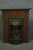 A Victorian cast iron fireplace and hearth with laurel swag detailing. H.105 W.86cm.