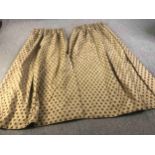 A pair of gold silk mix fully lined curtains with brown velvet spotted design. L.224 W.(top) 75 (