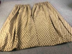 A pair of gold silk mix fully lined curtains with brown velvet spotted design. L.224 W.(top) 75 (