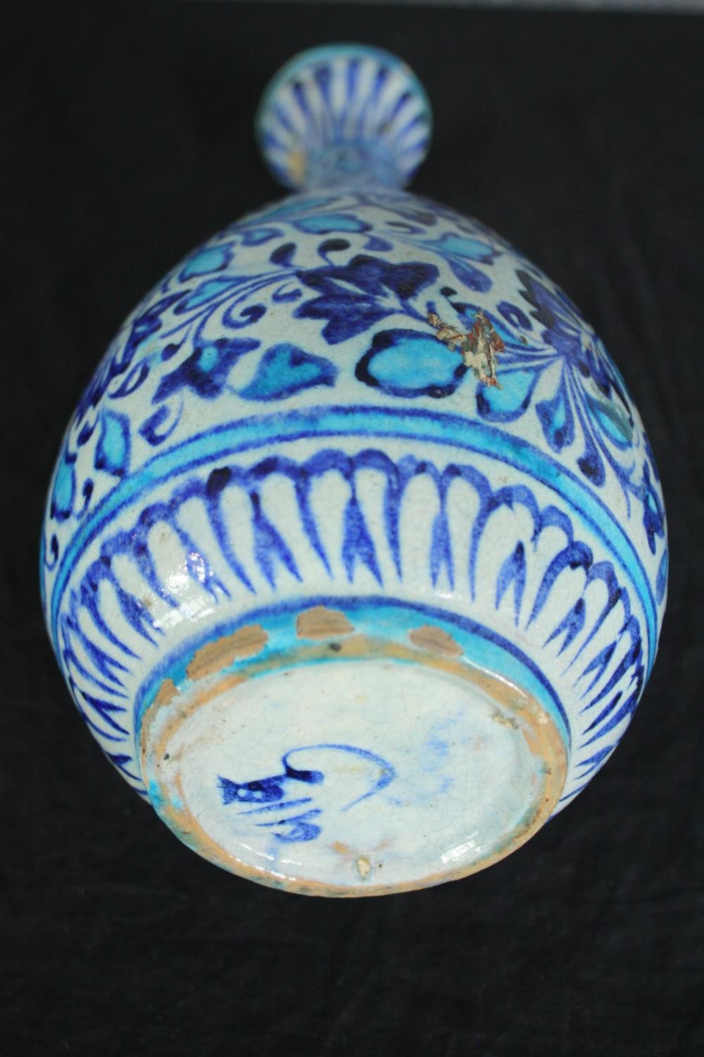 An early 20th century Multani blue and white floral hand painted vase. A little chipped with signs - Image 3 of 5