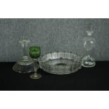 An assortment of early twentieth century glassware including a candlestick, decanter, and lime green