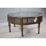 Coffee table, North African style hardwood with plate glass inset top. H.50 Dia.98cm.