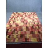 A contemporary William Yeoward woollen carpet of allover geometric design. L.308 W.233cm.