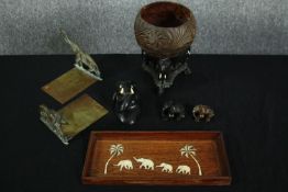 An elephant collection, including ebony carved elephants, a wooden tray decorated with bone