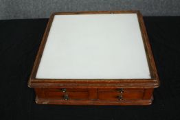 Dentist's cabinet, 19th century oak with opposing drawers and milk glass top. H.11 W.35 D.35cm.