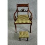 A Regency mahogany armchair along with a 19th century footstool covered in the same material.