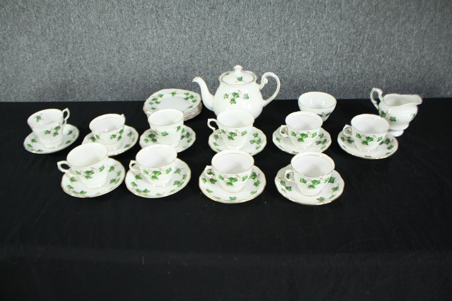 A Colclough ivy leaf tea set. Dated 1991. Incomplete. Includes a teapot, creamer, sugar bowl, side
