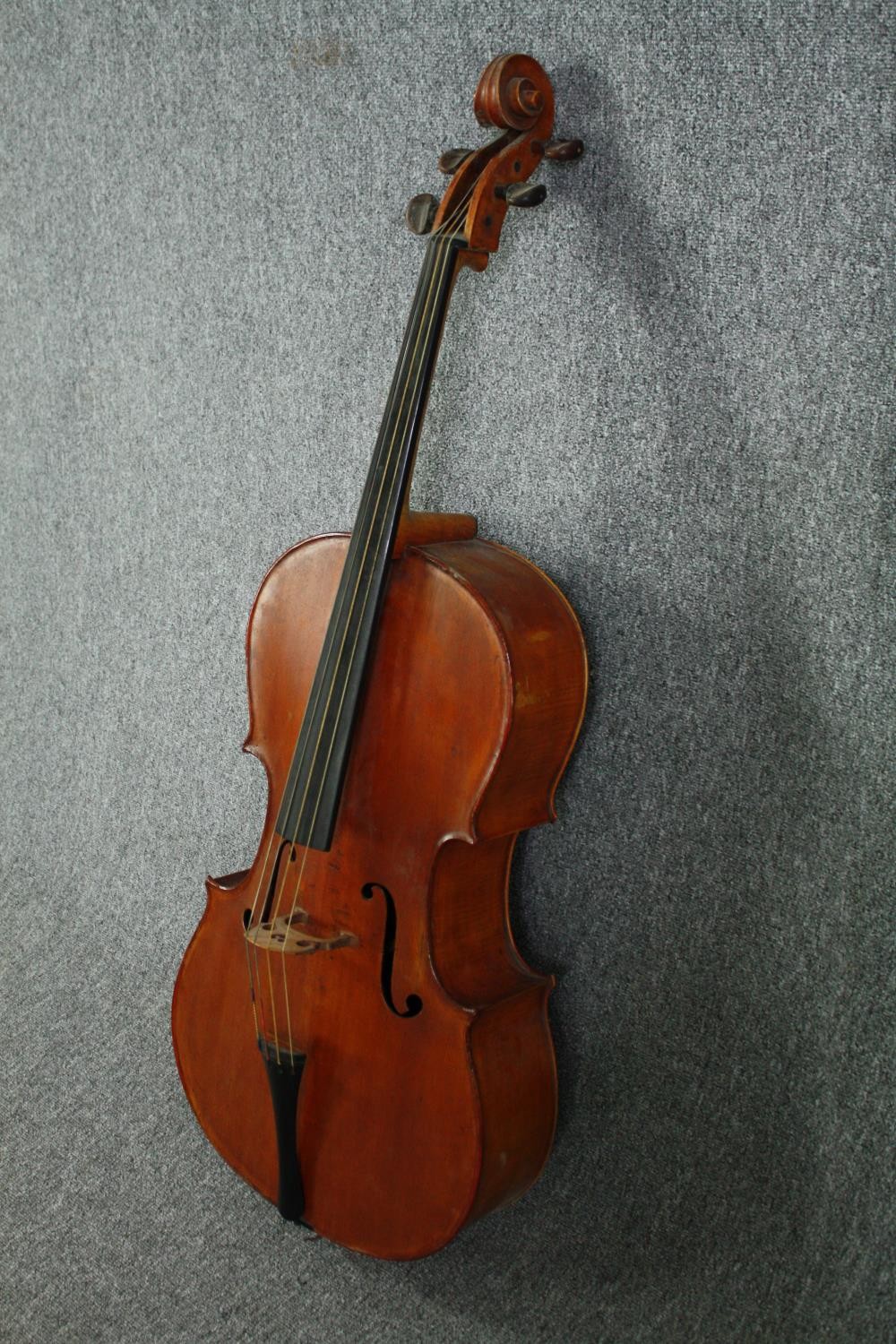 A cello in a soft case with no visible maker's mark. Road worn and with signs of being well - Image 4 of 6