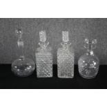 Four decanters with their stoppers. Cut glass with etched decoration. H.33cm. (largest)