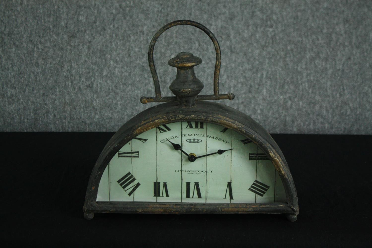 A modern industrial style half moon shelf clock. H.34 W.36 D.8cm.