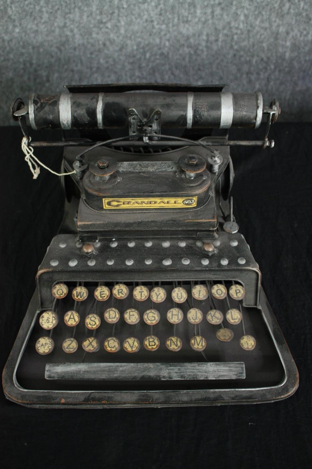 A light modern reproduction of a typewriter. H.17 W.30 D.33cm. - Image 3 of 3