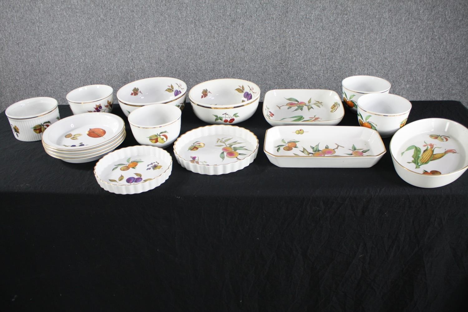 A set of sixteen pieces of Royal Worcester Evesham and Wild Harvest cook and serving ware. L.37 W.