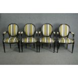 A set of four contemporary Louis XVI style armchairs with ebonised frames in striped upholstery. H.