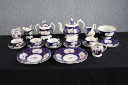A 19th century hand painted Gaudy Welsh decorative tea set. Incomplete. Includes teacups and