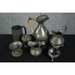 A mixed collection of pewterware. Including jugs, pots and a cup. H.20cm. (largest)