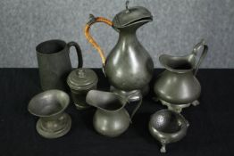 A mixed collection of pewterware. Including jugs, pots and a cup. H.20cm. (largest)