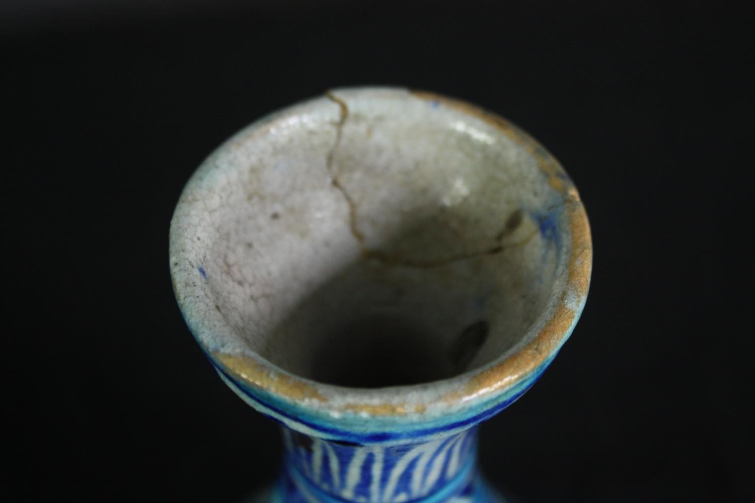 An early 20th century Multani blue and white floral hand painted vase. A little chipped with signs - Image 5 of 5