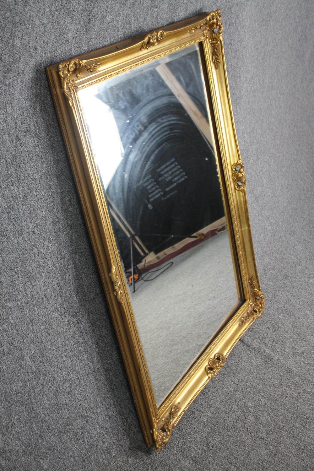 A gilt framed mirror with bevelled plate. H.106 W.75cm. - Image 2 of 4
