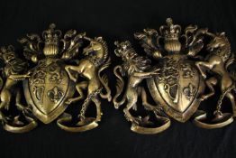 Two coats of arms. Polly-resin wall plaques in a distressed gold finish. Modern. H.35 W.37cm. (each)