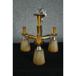 A 1930s Art Deco chandelier. Chromed metal with orange glass surrounds and three branches of