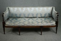 Sofa, 19th century mahogany framed upholstered in powder blue damask with buttoned squab cushion.
