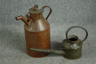 An nineteenth century copper milk churn with a metal watering can. The churn with some ageing and