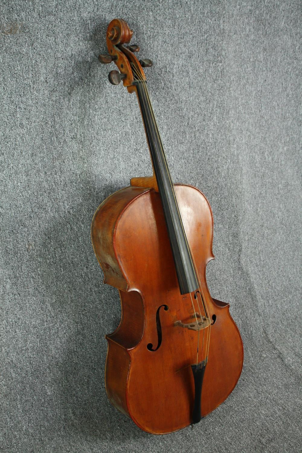 A cello in a soft case with no visible maker's mark. Road worn and with signs of being well - Image 3 of 6