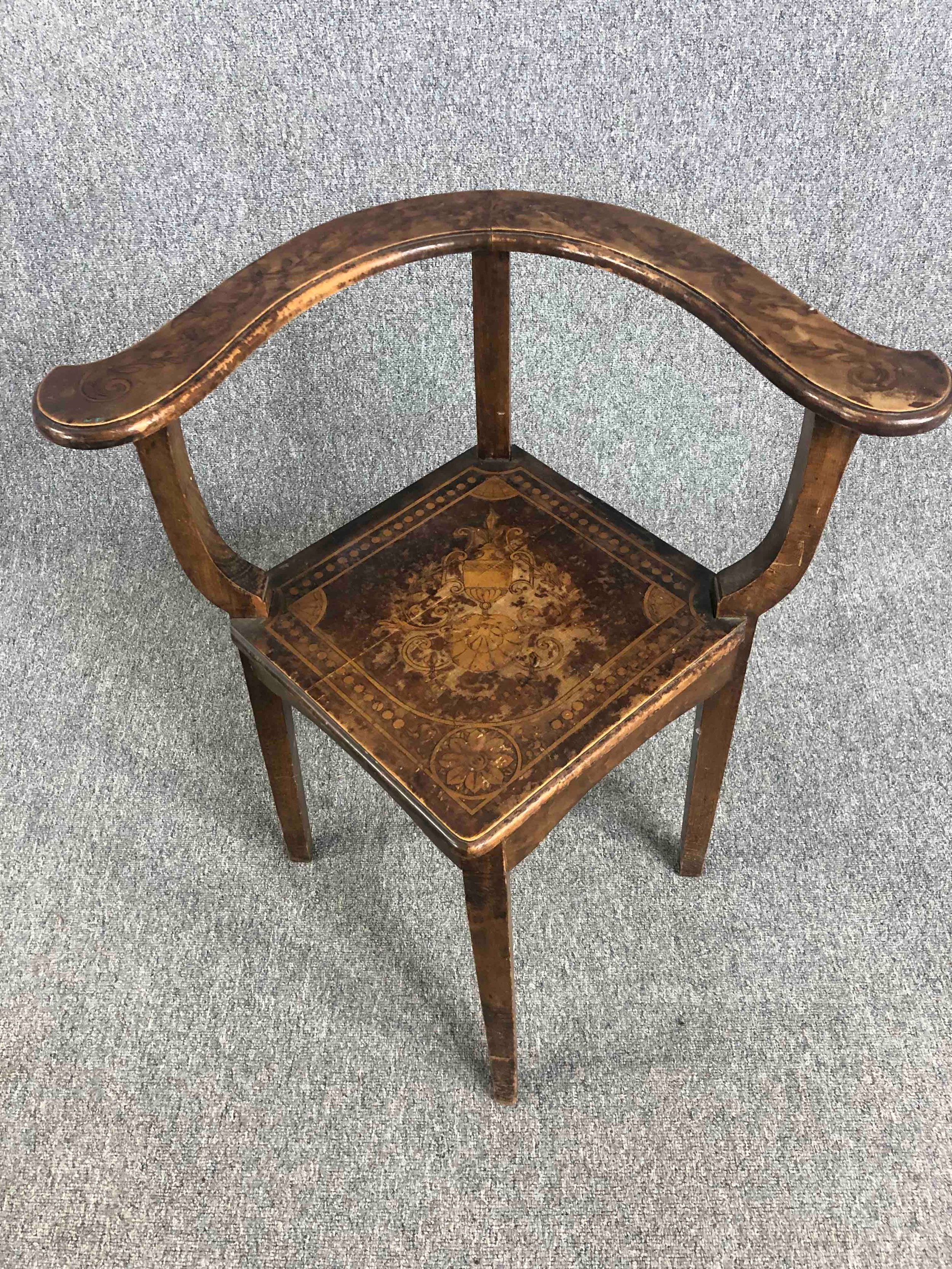 Corner chair, early 19th century oak with all over Classical style and scrolling foliate pen work