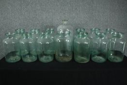 A collection of fourteen large glass pickling jars. Probably early twentieth century but maybe