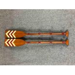 A pair of coats hooks mounted on reproduction wooden oars. L.120cm. (each)