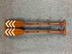 A pair of coats hooks mounted on reproduction wooden oars. L.120cm. (each)