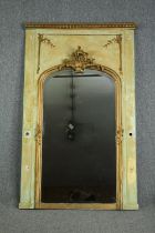 A 19th century French painted panel with giltwood and gesso pier glass with Rococo cresting above