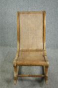 Rocking chair, 19th century beech framed and caned. H.90cm.