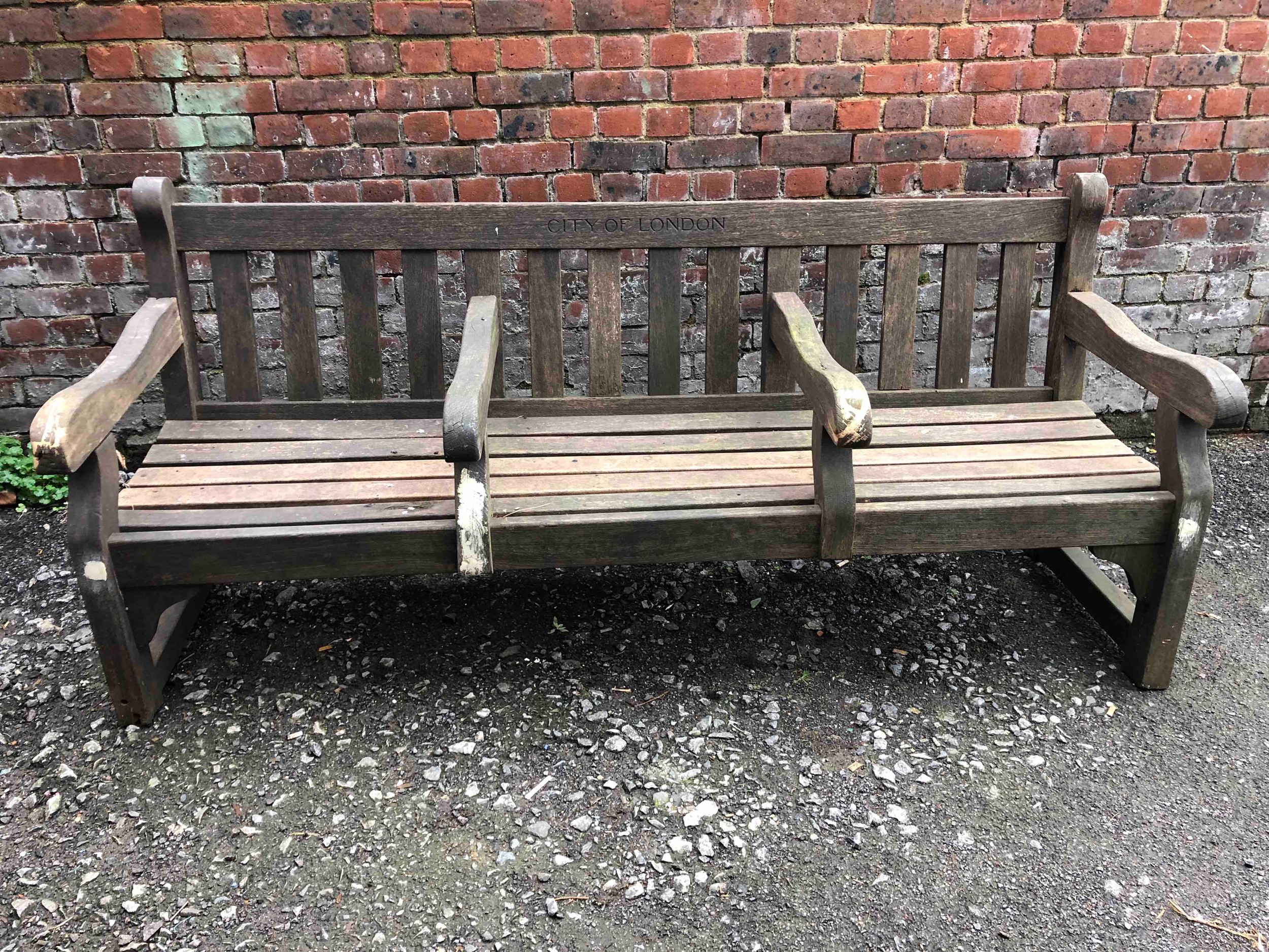 City of London vintage park bench seats in weathered teak. H.87 W.196 D.73cm.