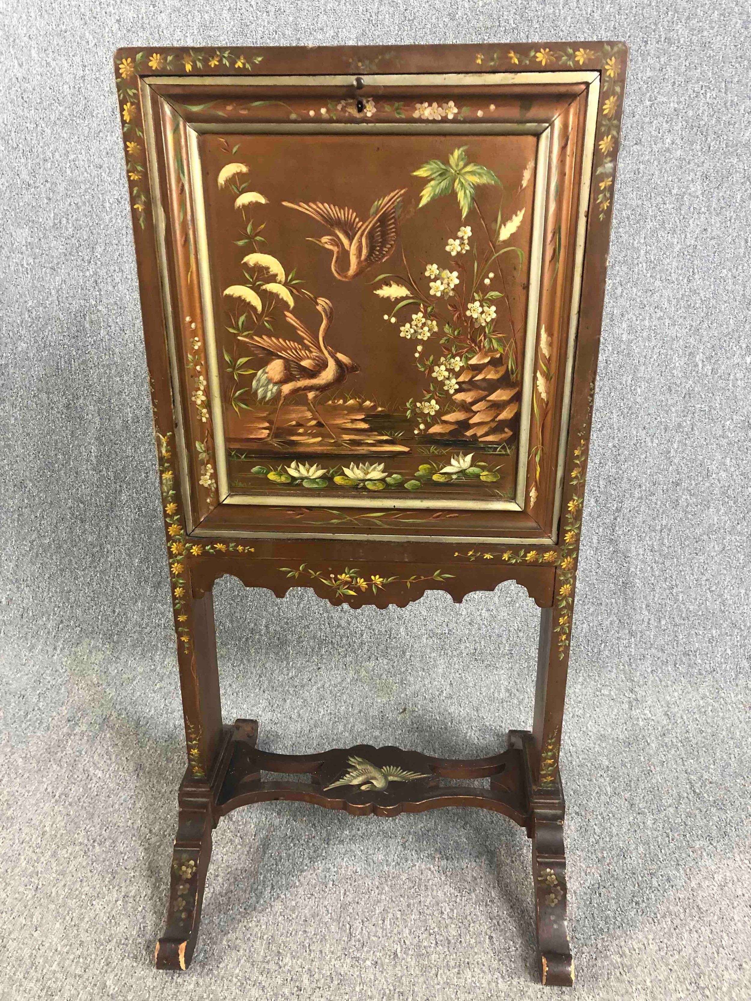 A late 19th century Chinoiserie decorated and lacquered secretaire screen with fall front