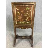 A late 19th century Chinoiserie decorated and lacquered secretaire screen with fall front