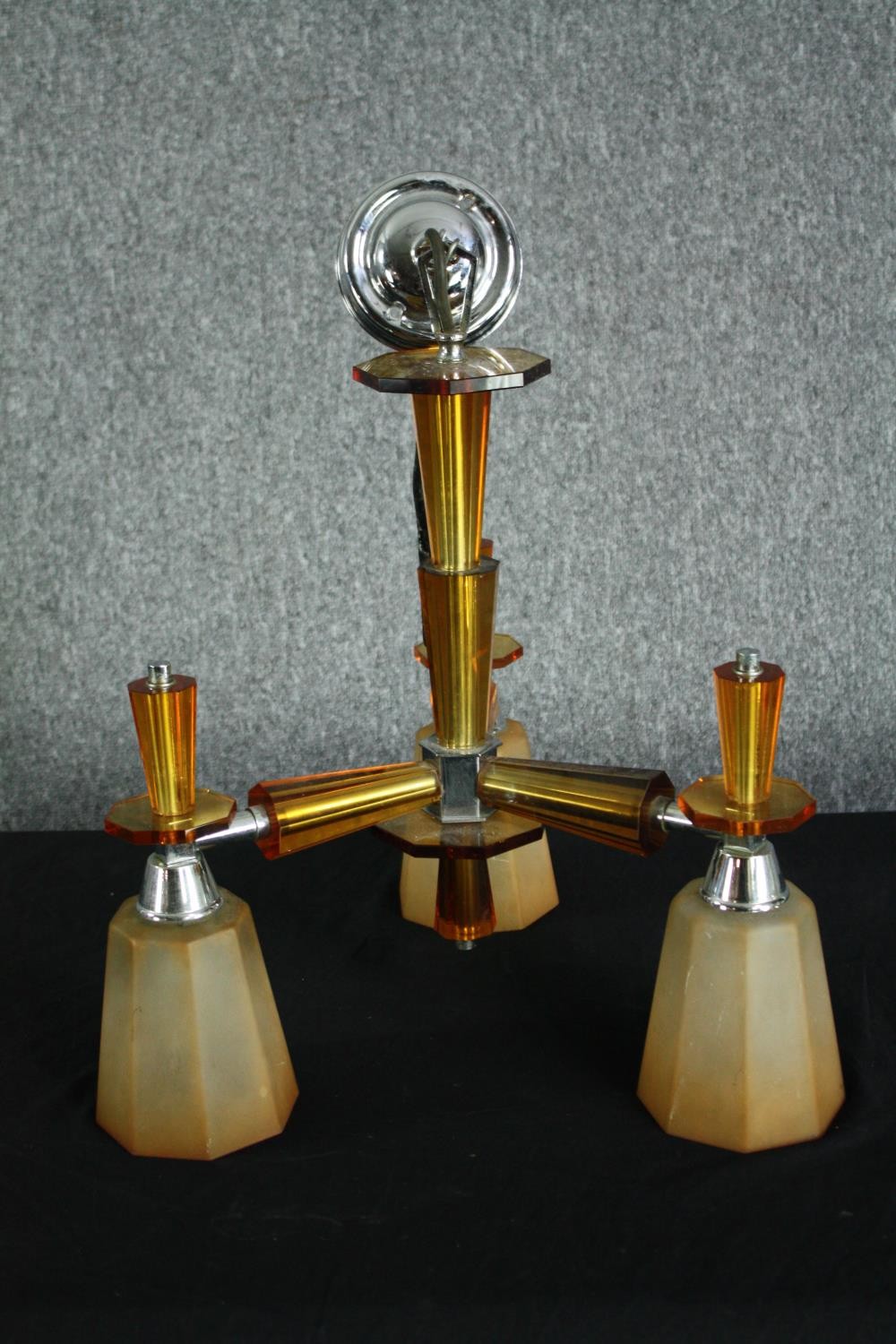 A 1930s Art Deco chandelier. Chromed metal with orange glass surrounds and three branches of - Image 2 of 7