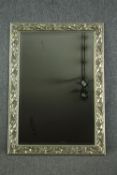 Wall mirror, contemporary silvered foliate frame with bevelled plate. H.107 W.76cm.