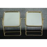 A pair of contemporary metal framed swing mirrors. H.46 W.39cm. (each)