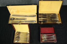 A collection of boxed silver plated spoons, knifes and a carving set. Made by Orbrille and Chaperon.