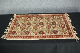 A small Chinese handmade rug. H.84 W.50cm.