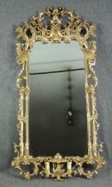 Pier mirror, full height carved giltwood in the Chinese Chippendale style. H.200 W.100cm.