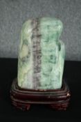 A large Chinese scholar's rock, Fluorite, varying tones of green with patches of purple and white,