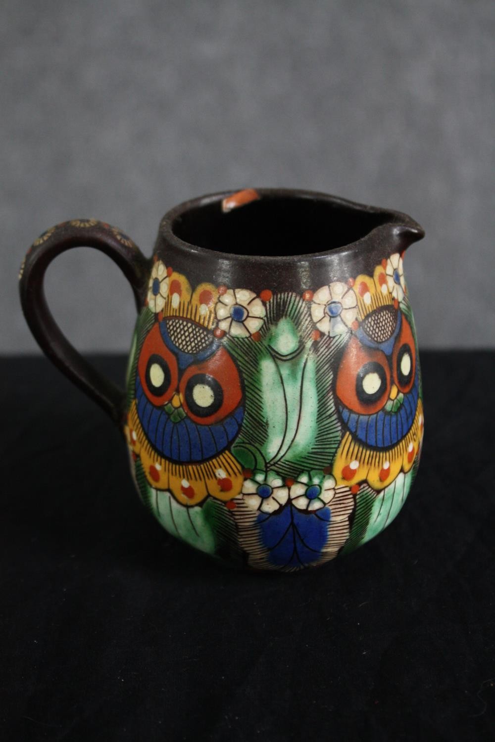 A Thoune owl jug. Swiss pottery. Signed on the base and numbered 30. H.10cm.