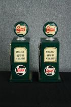 Two wooden storage cupboards in the shape of Castrol petrol pumps. Hand painted in a distressed